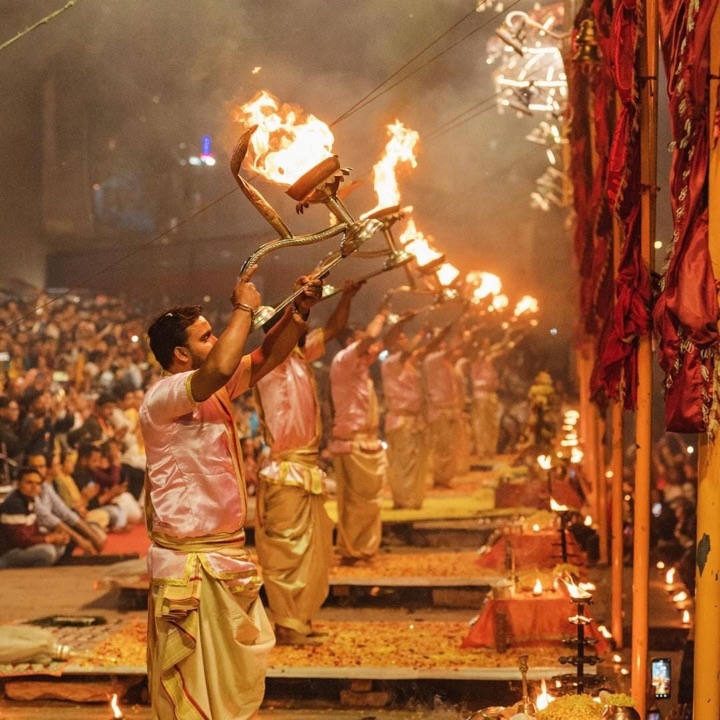 Priests performing the Ganga Aarti with lamps at Varanasi